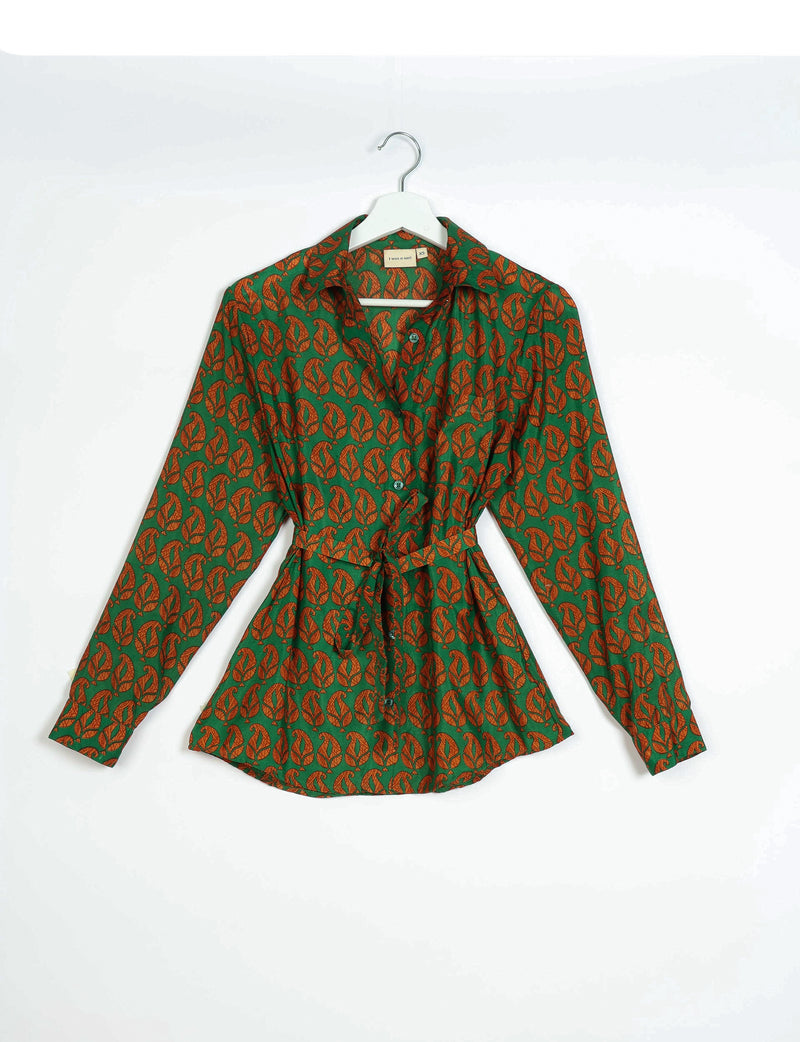 Green button-up shirt with orange leaf pattern, long sleeves, collar, and waist tie, hanging on white hanger front view
