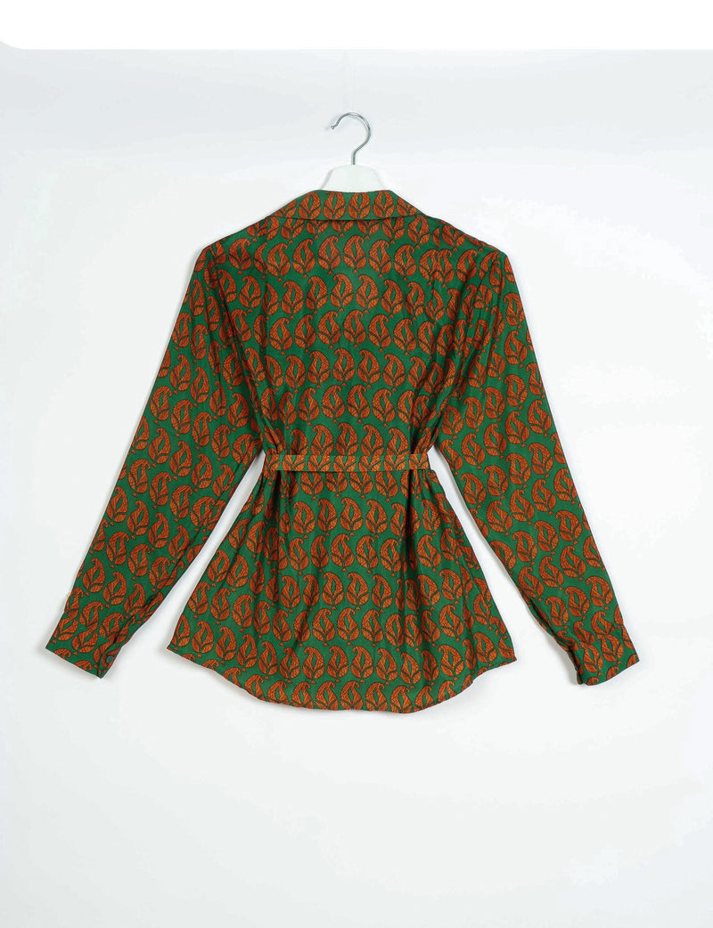 Green long-sleeve shirt with orange leaf pattern, buttoned cuffs, and a belt, shown from back on a white hanger