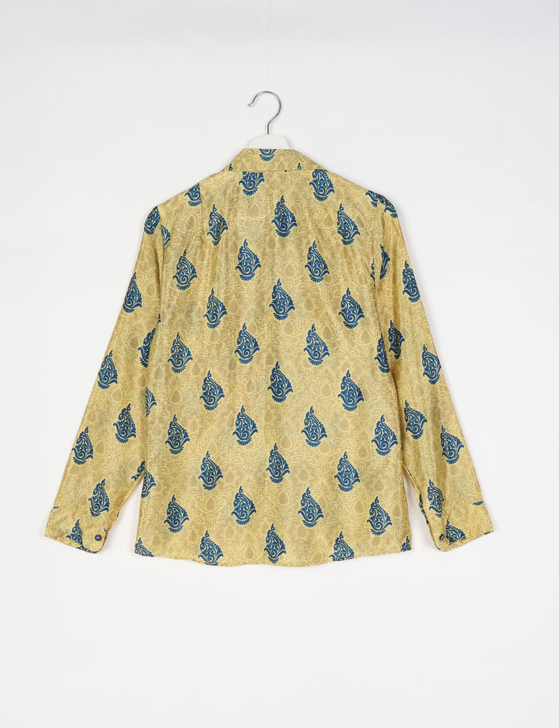 Yellow long-sleeve shirt with blue paisley print, buttoned cuffs, and spread collar, shown from back on hanger