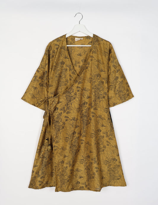 Elevate your style with our Sunset Coat, a shin-length wrap featuring a deep V-neck, wide flared 3/4 sleeves, and side tie with thread tassels. Embrace ethical and sustainable fashion with this zero waste, upcycled garment. A perfect blend of elegance and whimsy for conscious clothing enthusiasts.