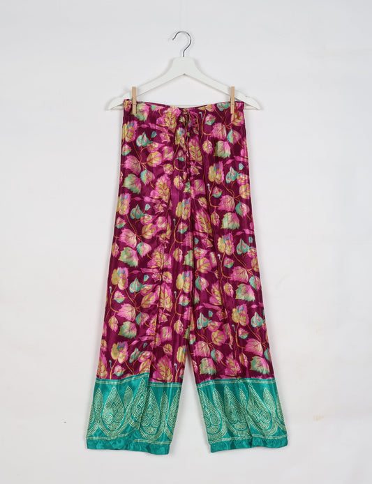 Immerse yourself in the vibrant allure of our PANTA PAREO – a distinctive piece made from handpicked, pre-worn saris, and carefully reworked by local artisans. This pareo is more than just a getaway must-have; it's a sustainable statement. Ideal as a layer over a bikini or a stylish throw, it brings eco-friendly charm to any room in your home. Embrace the colorful elegance of repurposed saris with the PANTA PAREO – an essential addition to your wardrobe for conscious and stylish living.