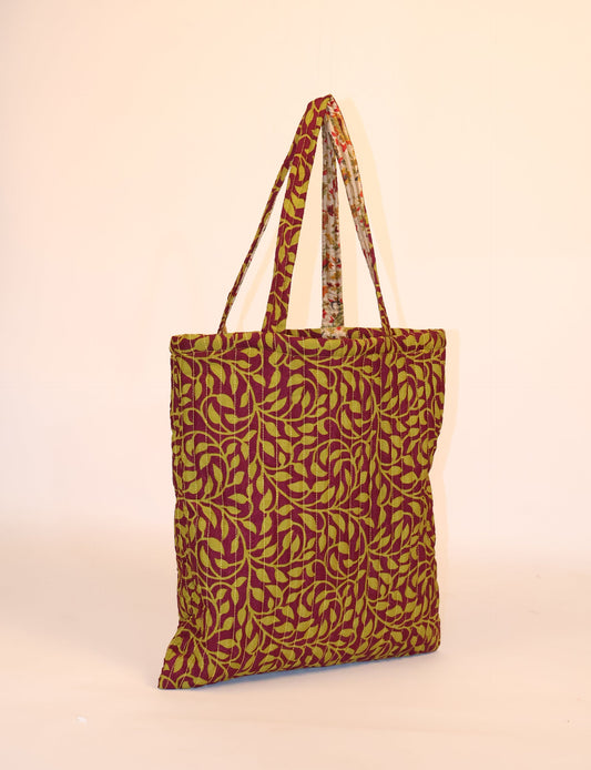 Elevate your style sustainably with our QUILTED SHOPPER BAG. Soft textures, vibrant colors, and a positive impact on people and the planet. Perfect for the office, shopping, or happy hour. Crafted from pre-loved saris for eco-conscious fashionistas!