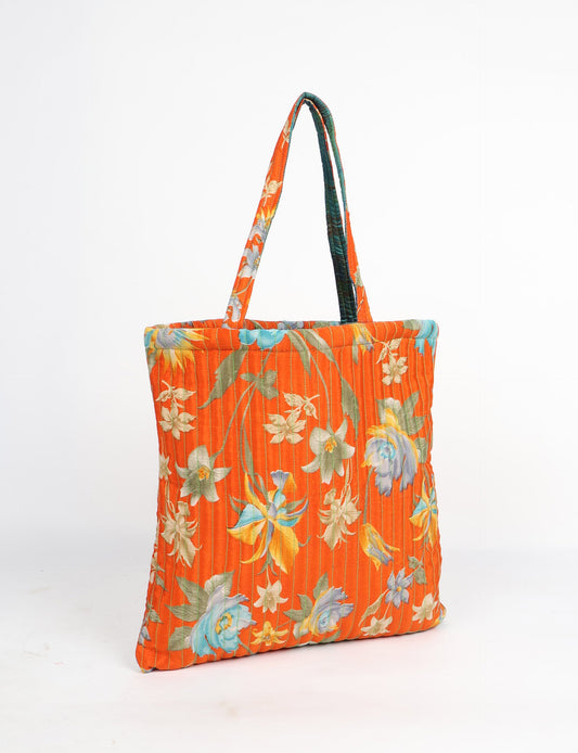 Elevate your style sustainably with our QUILTED SHOPPER BAG. Soft textures, vibrant colors, and a positive impact on people and the planet. Perfect for the office, shopping, or happy hour. Crafted from pre-loved saris for eco-conscious fashionistas!