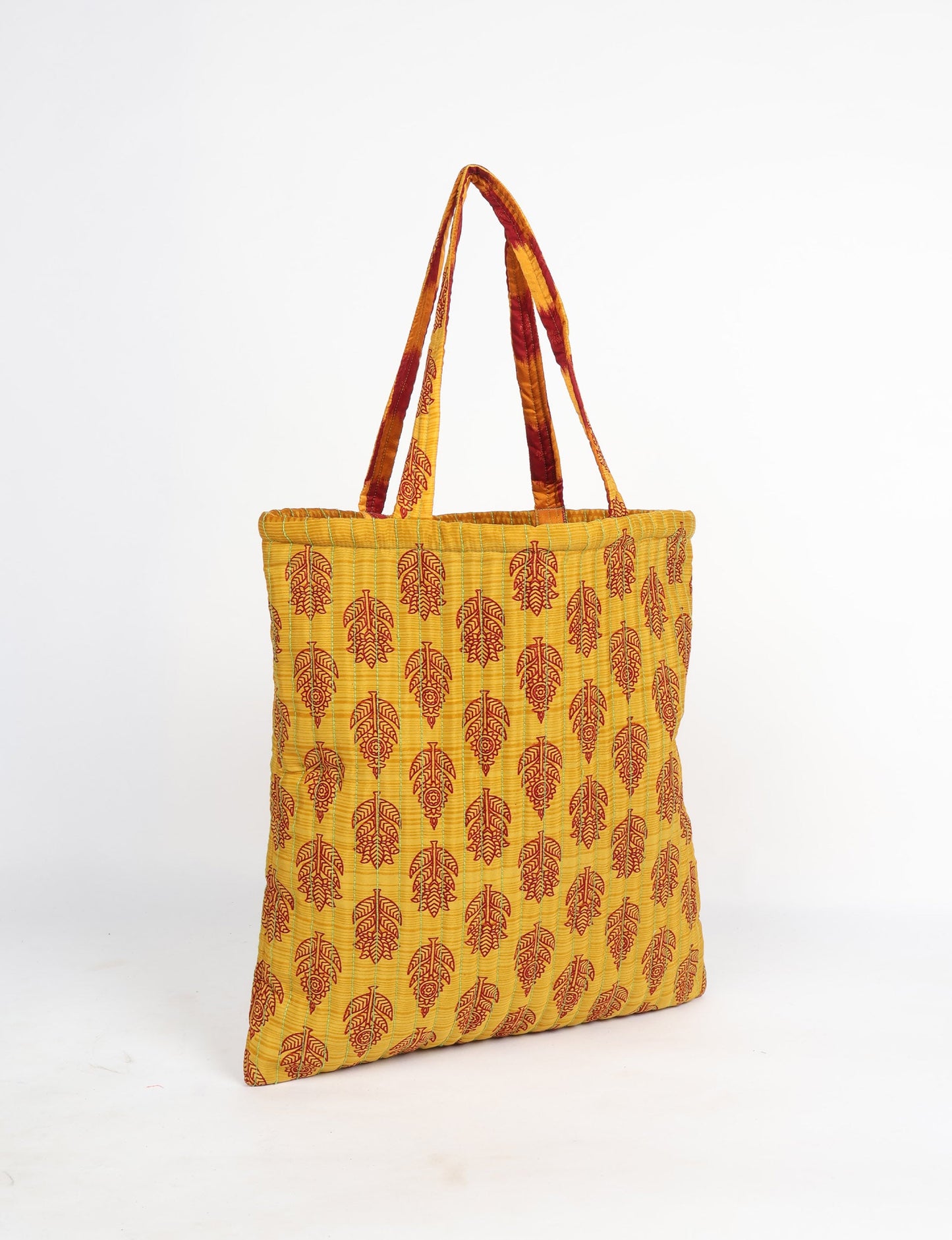 Elevate your style sustainably with our QUILTED SHOPPER BAG. Soft textures, vibrant colors, and a positive impact on people and the planet. Perfect for the office, shopping, or happy hour. Crafted from pre-loved saris for eco-conscious fashionistas!