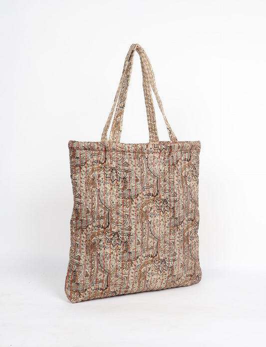 Elevate your style sustainably with our QUILTED SHOPPER BAG. Soft textures, vibrant colors, and a positive impact on people and the planet. Perfect for the office, shopping, or happy hour. Crafted from pre-loved saris for eco-conscious fashionistas!