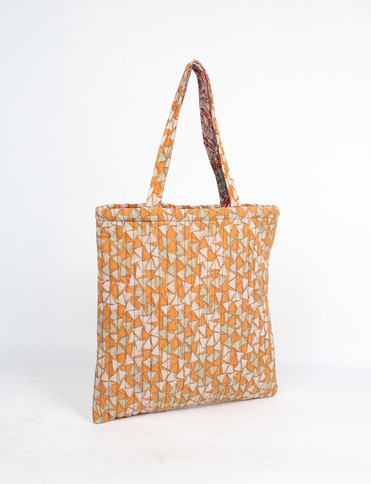Elevate your style sustainably with our QUILTED SHOPPER BAG. Soft textures, vibrant colors, and a positive impact on people and the planet. Perfect for the office, shopping, or happy hour. Crafted from pre-loved saris for eco-conscious fashionistas!