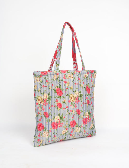 Elevate your style sustainably with our QUILTED SHOPPER BAG. Soft textures, vibrant colors, and a positive impact on people and the planet. Perfect for the office, shopping, or happy hour. Crafted from pre-loved saris for eco-conscious fashionistas!