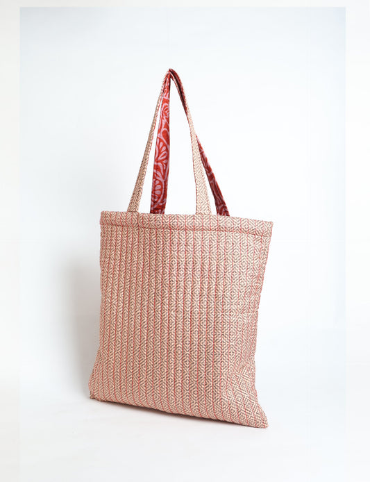 Elevate your style sustainably with our QUILTED SHOPPER BAG. Soft textures, vibrant colors, and a positive impact on people and the planet. Perfect for the office, shopping, or happy hour. Crafted from pre-loved saris for eco-conscious fashionistas!