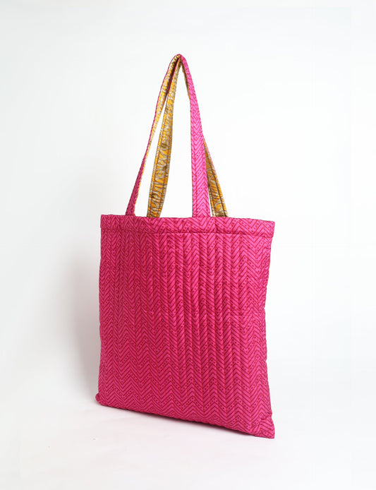 Elevate your style sustainably with our QUILTED SHOPPER BAG. Soft textures, vibrant colors, and a positive impact on people and the planet. Perfect for the office, shopping, or happy hour. Crafted from pre-loved saris for eco-conscious fashionistas!