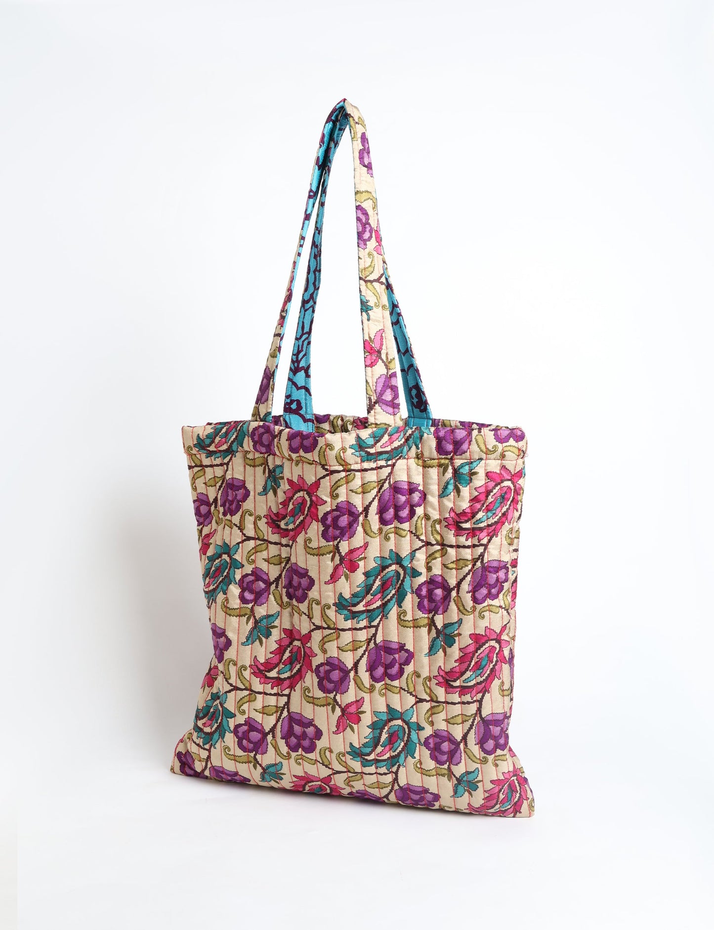 Elevate your style sustainably with our QUILTED SHOPPER BAG. Soft textures, vibrant colors, and a positive impact on people and the planet. Perfect for the office, shopping, or happy hour. Crafted from pre-loved saris for eco-conscious fashionistas!