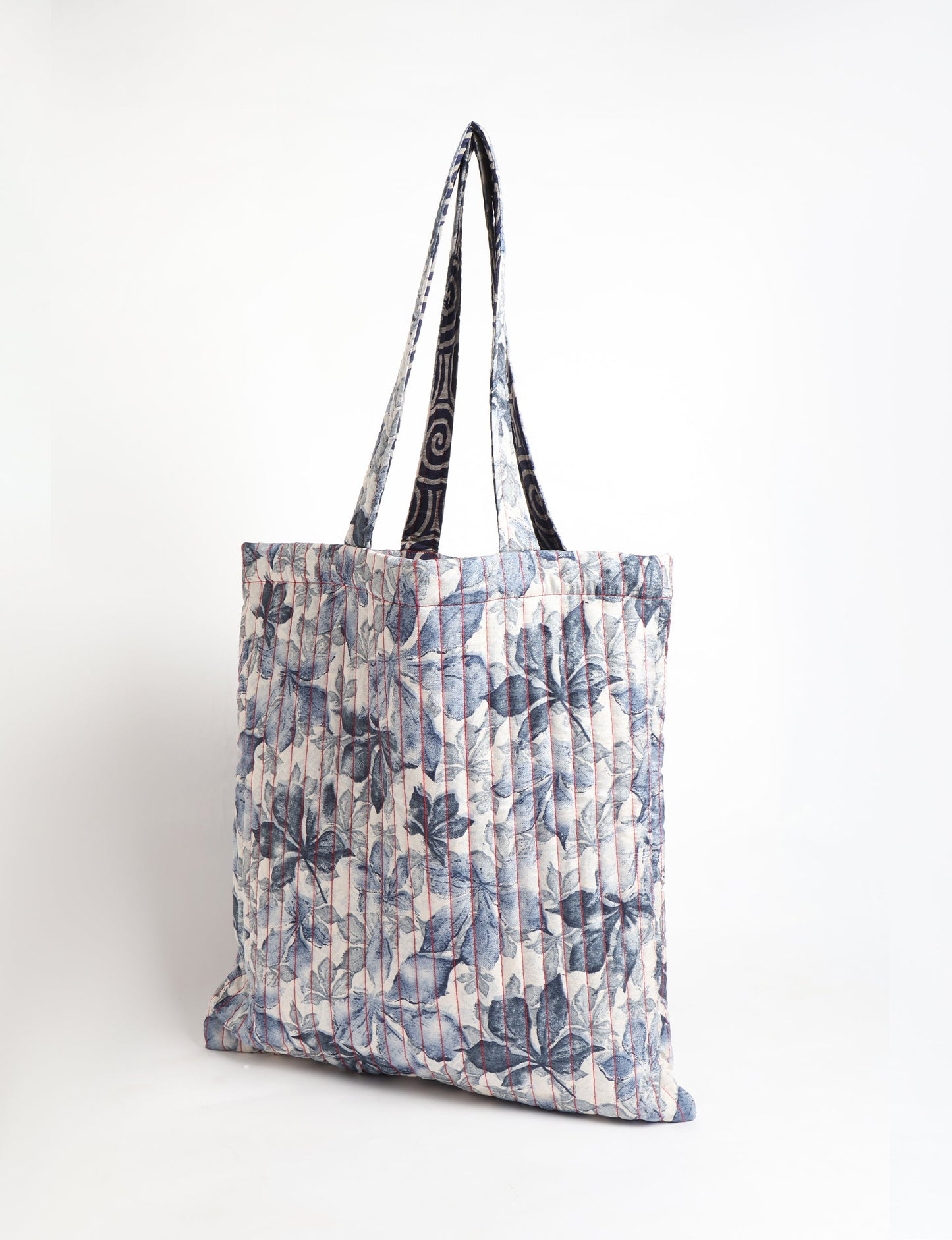 Elevate your style sustainably with our QUILTED SHOPPER BAG. Soft textures, vibrant colors, and a positive impact on people and the planet. Perfect for the office, shopping, or happy hour. Crafted from pre-loved saris for eco-conscious fashionistas!