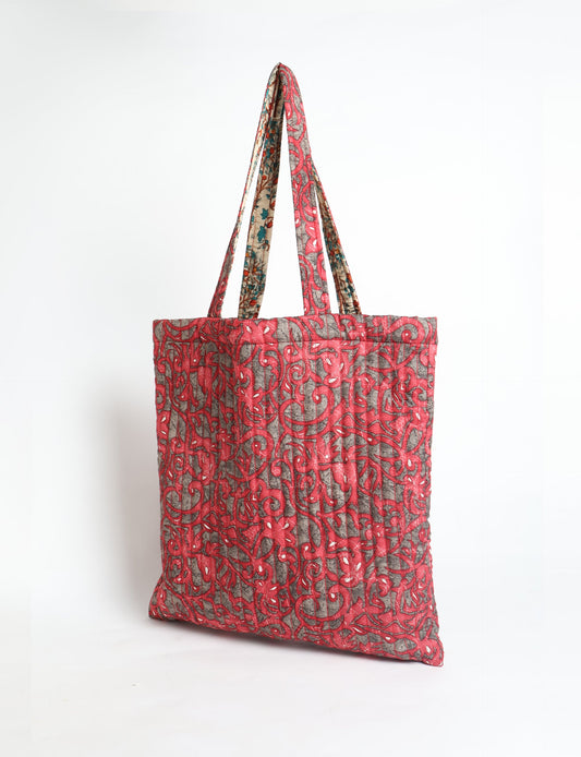 Elevate your style sustainably with our QUILTED SHOPPER BAG. Soft textures, vibrant colors, and a positive impact on people and the planet. Perfect for the office, shopping, or happy hour. Crafted from pre-loved saris for eco-conscious fashionistas!