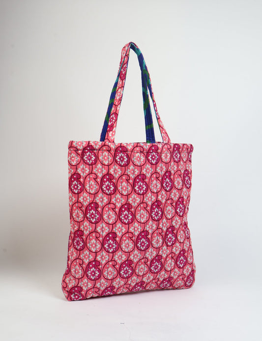 Elevate your style sustainably with our QUILTED SHOPPER BAG. Soft textures, vibrant colors, and a positive impact on people and the planet. Perfect for the office, shopping, or happy hour. Crafted from pre-loved saris for eco-conscious fashionistas!