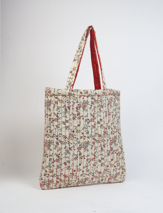 Elevate your style sustainably with our QUILTED SHOPPER BAG. Soft textures, vibrant colors, and a positive impact on people and the planet. Perfect for the office, shopping, or happy hour. Crafted from pre-loved saris for eco-conscious fashionistas!