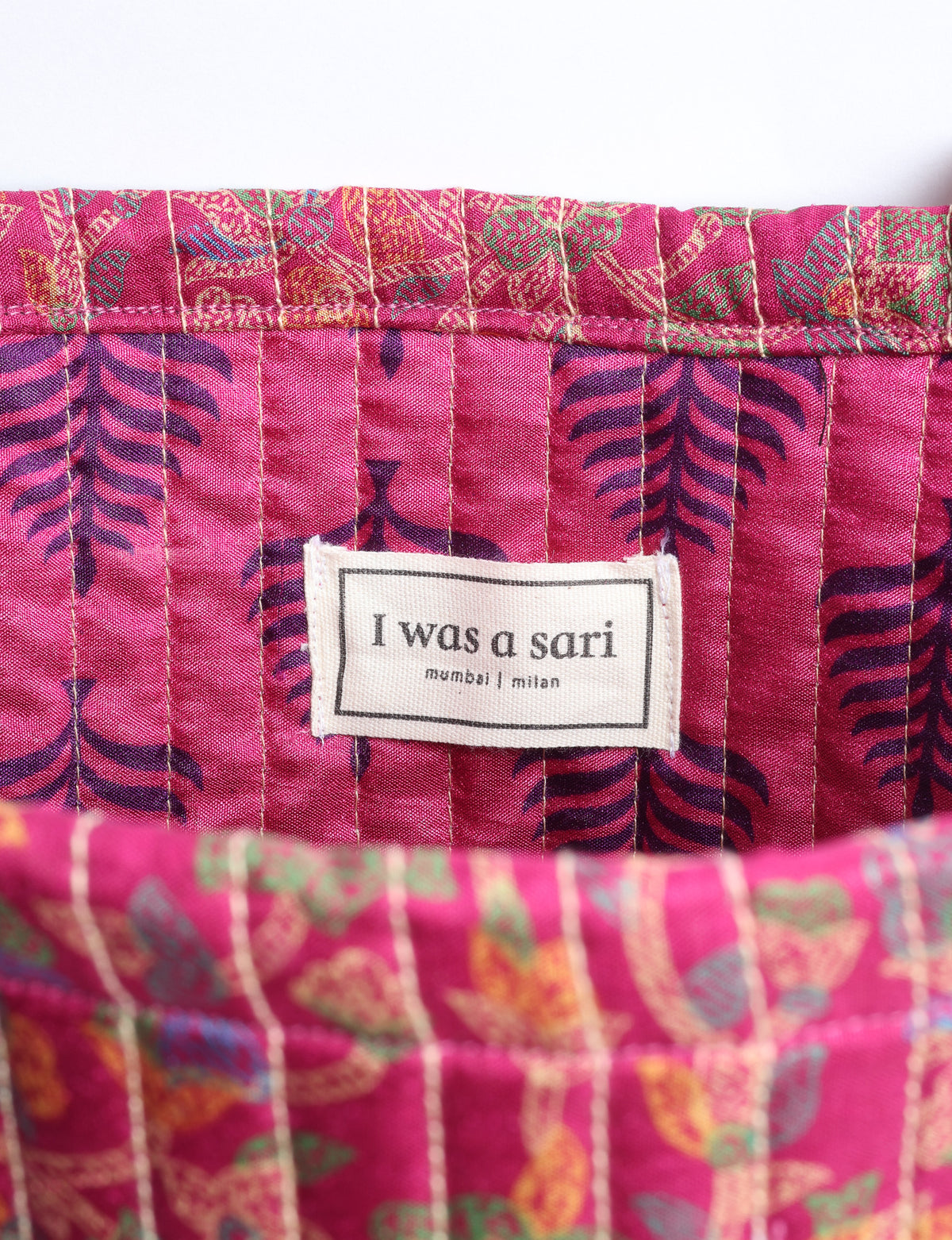 Elevate your style sustainably with our QUILTED SHOPPER BAG. Soft textures, vibrant colors, and a positive impact on people and the planet. Perfect for the office, shopping, or happy hour. Crafted from pre-loved saris for eco-conscious fashionistas!