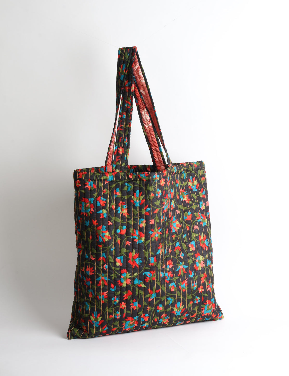 Elevate your style sustainably with our QUILTED SHOPPER BAG. Soft textures, vibrant colors, and a positive impact on people and the planet. Perfect for the office, shopping, or happy hour. Crafted from pre-loved saris for eco-conscious fashionistas!
