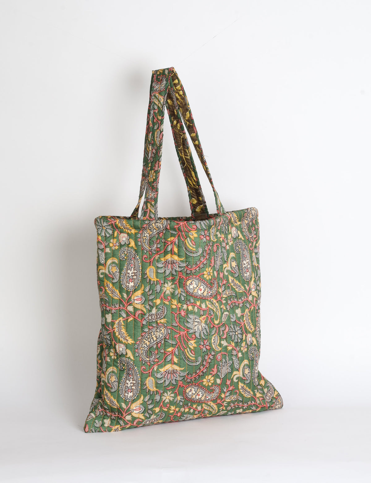 Elevate your style sustainably with our QUILTED SHOPPER BAG. Soft textures, vibrant colors, and a positive impact on people and the planet. Perfect for the office, shopping, or happy hour. Crafted from pre-loved saris for eco-conscious fashionistas!