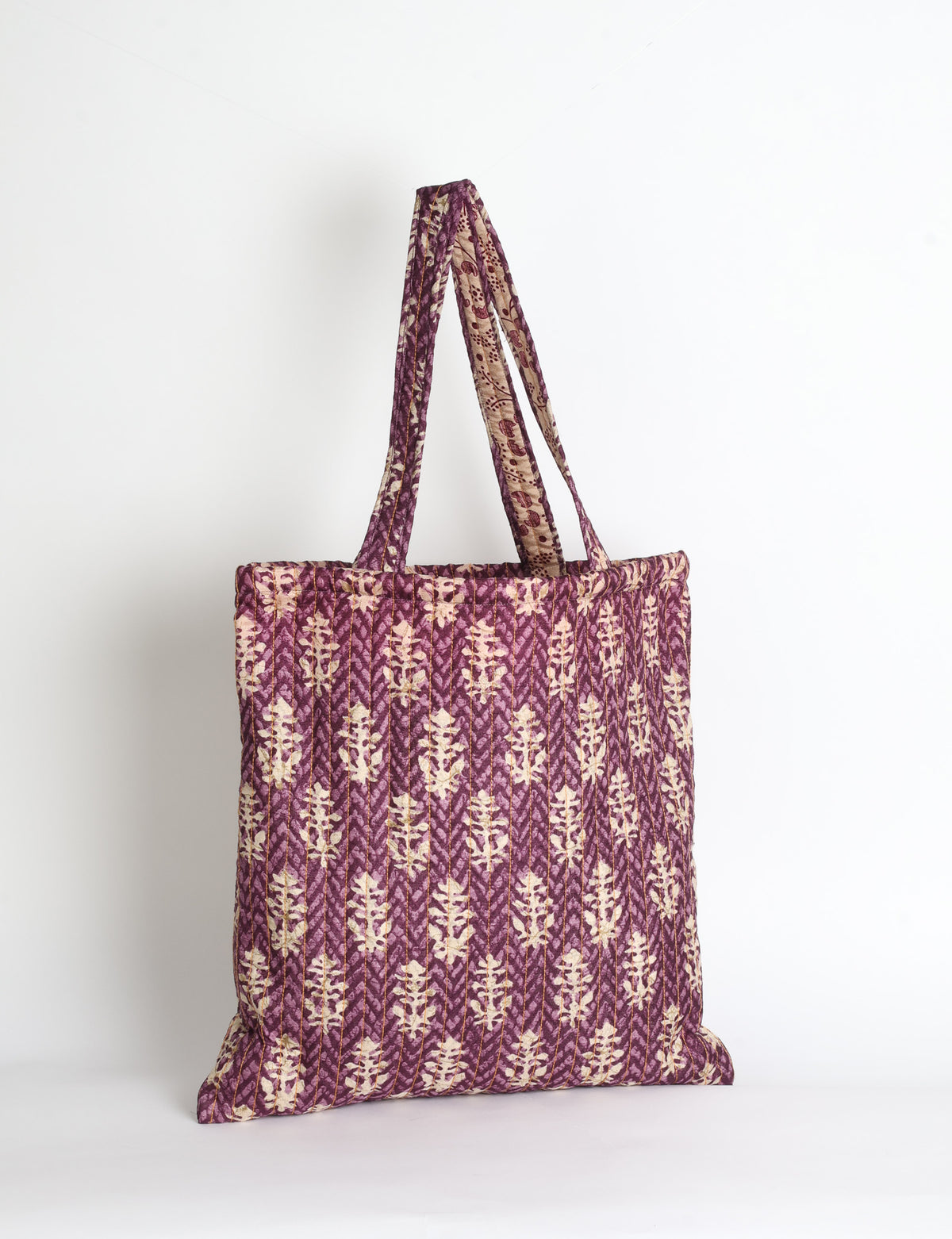 Elevate your style sustainably with our QUILTED SHOPPER BAG. Soft textures, vibrant colors, and a positive impact on people and the planet. Perfect for the office, shopping, or happy hour. Crafted from pre-loved saris for eco-conscious fashionistas!