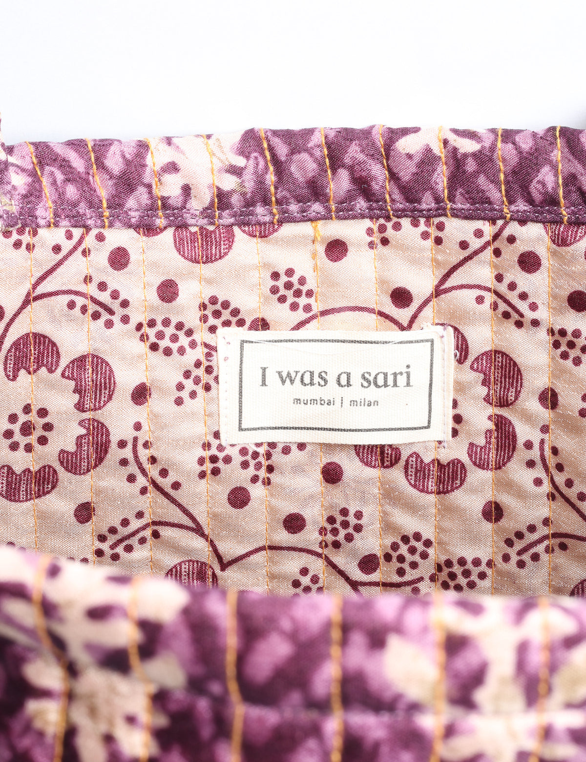 Elevate your style sustainably with our QUILTED SHOPPER BAG. Soft textures, vibrant colors, and a positive impact on people and the planet. Perfect for the office, shopping, or happy hour. Crafted from pre-loved saris for eco-conscious fashionistas!