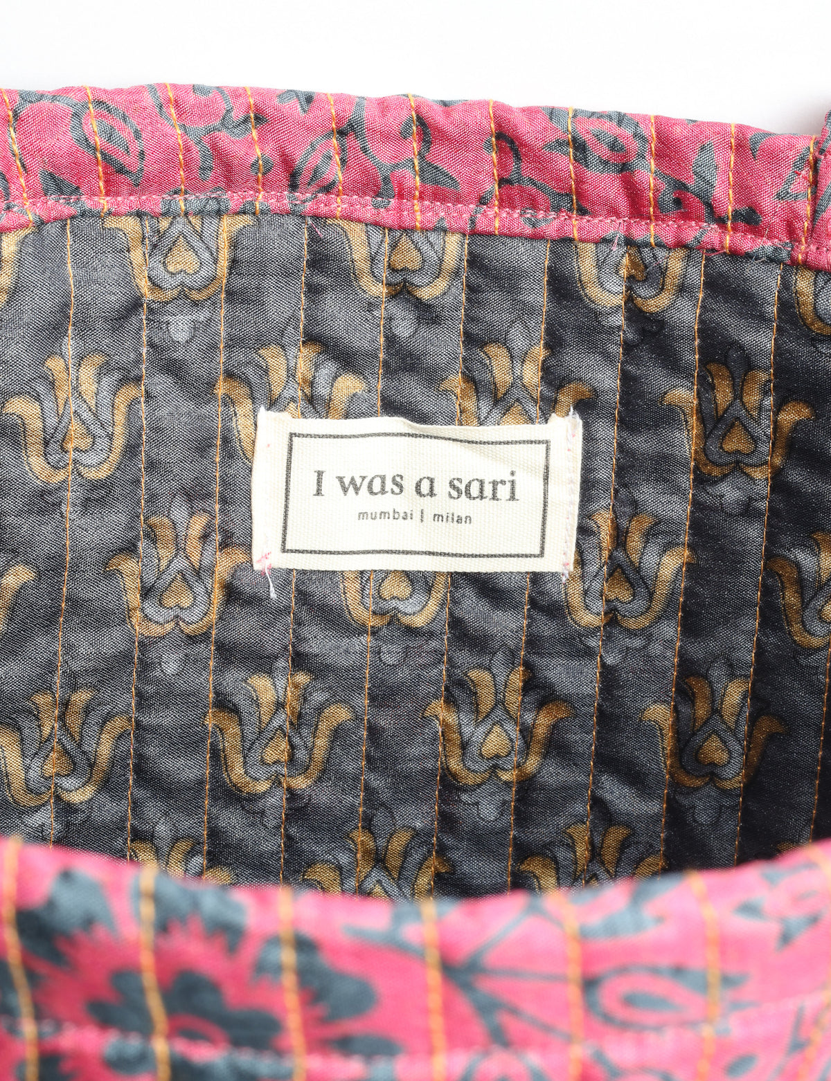 Elevate your style sustainably with our QUILTED SHOPPER BAG. Soft textures, vibrant colors, and a positive impact on people and the planet. Perfect for the office, shopping, or happy hour. Crafted from pre-loved saris for eco-conscious fashionistas!
