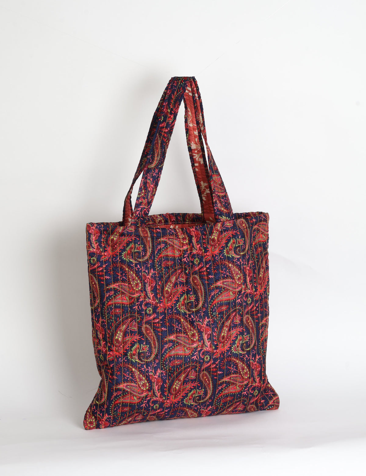 Elevate your style sustainably with our QUILTED SHOPPER BAG. Soft textures, vibrant colors, and a positive impact on people and the planet. Perfect for the office, shopping, or happy hour. Crafted from pre-loved saris for eco-conscious fashionistas!