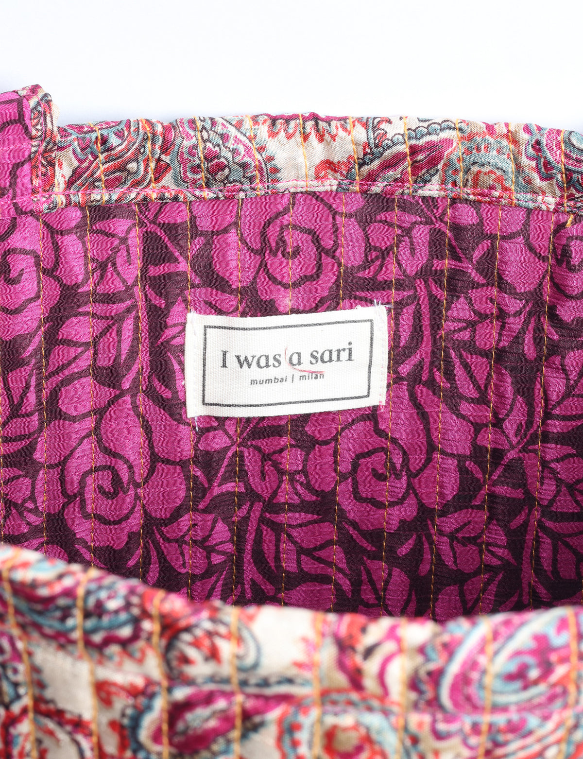 Elevate your style sustainably with our QUILTED SHOPPER BAG. Soft textures, vibrant colors, and a positive impact on people and the planet. Perfect for the office, shopping, or happy hour. Crafted from pre-loved saris for eco-conscious fashionistas!