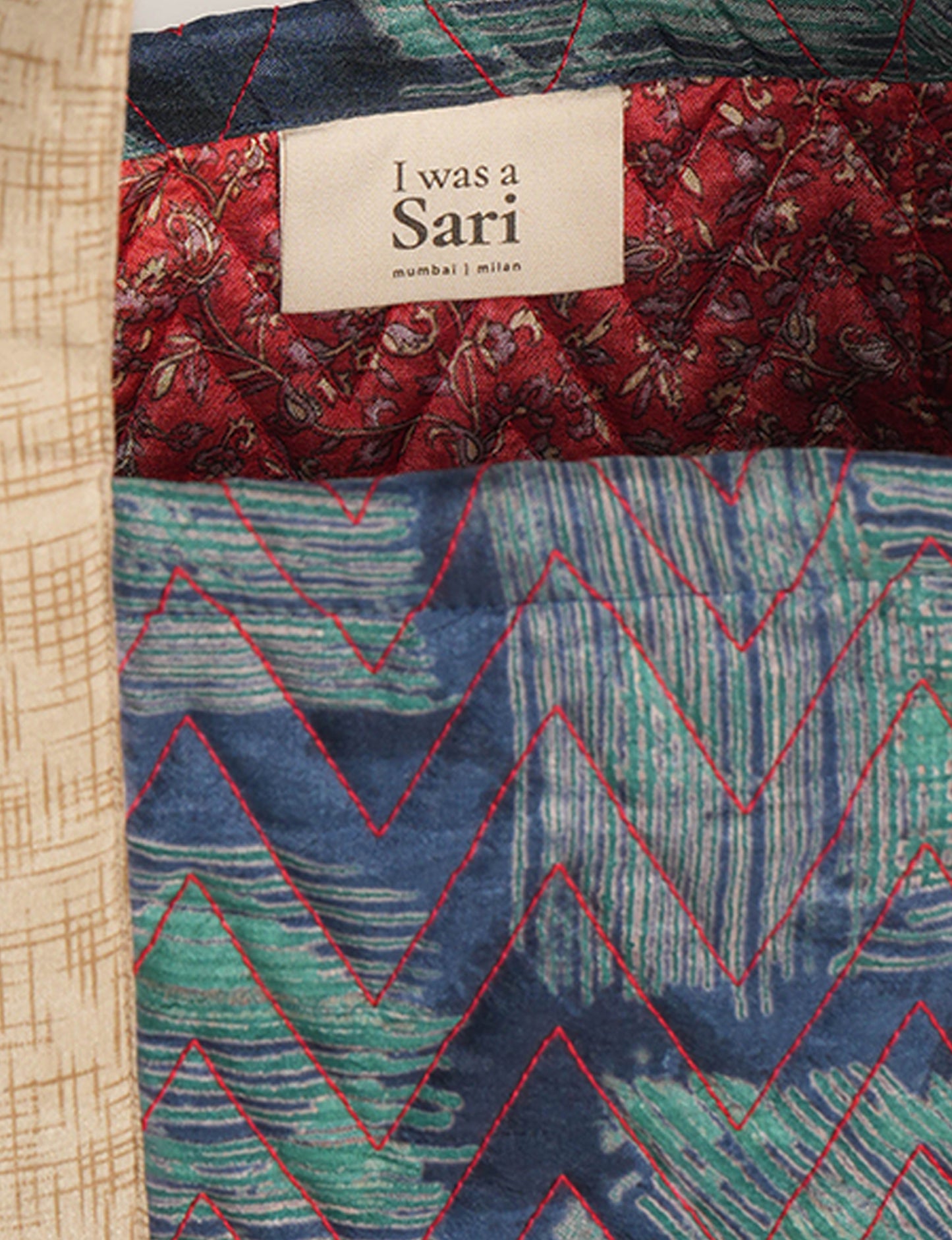 Elevate your style with our Quilted Tote Bag, a perfect fusion of fashion and sustainability. Made from vibrant upcycled saris, the newly quilted design adds strength and softness. With double fabric contrast straps and a unique sari lining, it's a statement of ethical elegance.