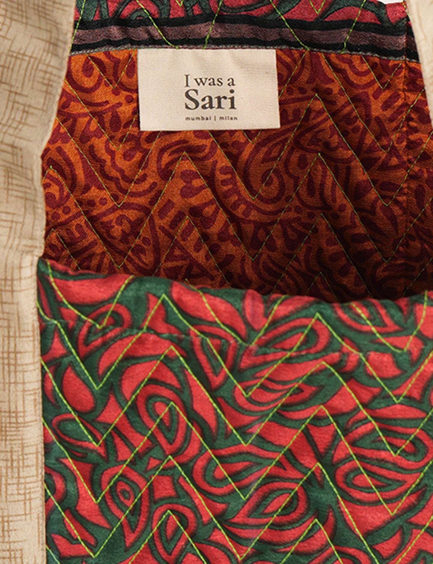 Elevate your style with our Quilted Tote Bag, a perfect fusion of fashion and sustainability. Made from vibrant upcycled saris, the newly quilted design adds strength and softness. With double fabric contrast straps and a unique sari lining, it's a statement of ethical elegance.