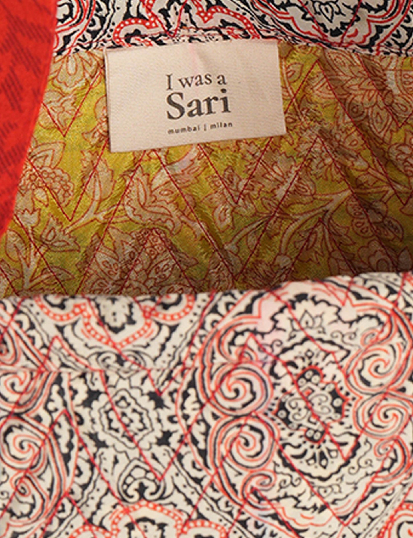 Elevate your style with our Quilted Tote Bag, a perfect fusion of fashion and sustainability. Made from vibrant upcycled saris, the newly quilted design adds strength and softness. With double fabric contrast straps and a unique sari lining, it's a statement of ethical elegance.