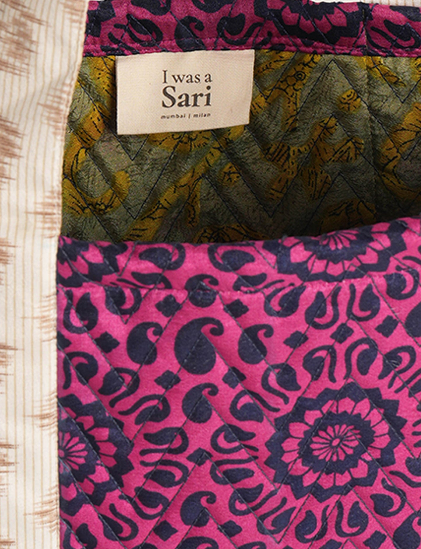 Elevate your style with our Quilted Tote Bag, a perfect fusion of fashion and sustainability. Made from vibrant upcycled saris, the newly quilted design adds strength and softness. With double fabric contrast straps and a unique sari lining, it's a statement of ethical elegance.