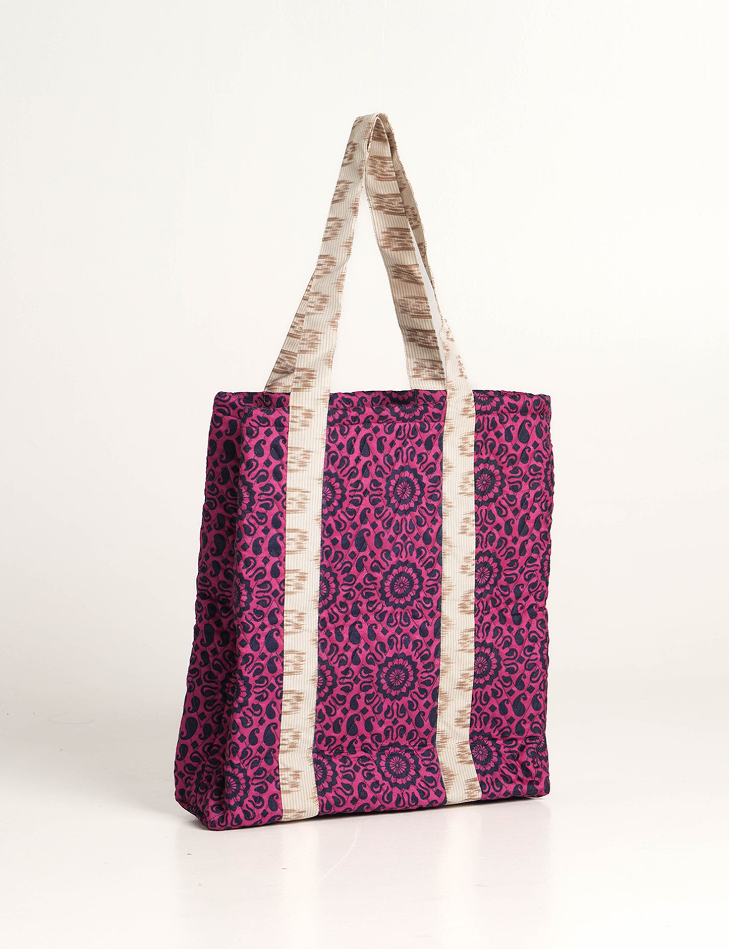 Elevate your style with our Quilted Tote Bag, a perfect fusion of fashion and sustainability. Made from vibrant upcycled saris, the newly quilted design adds strength and softness. With double fabric contrast straps and a unique sari lining, it's a statement of ethical elegance.