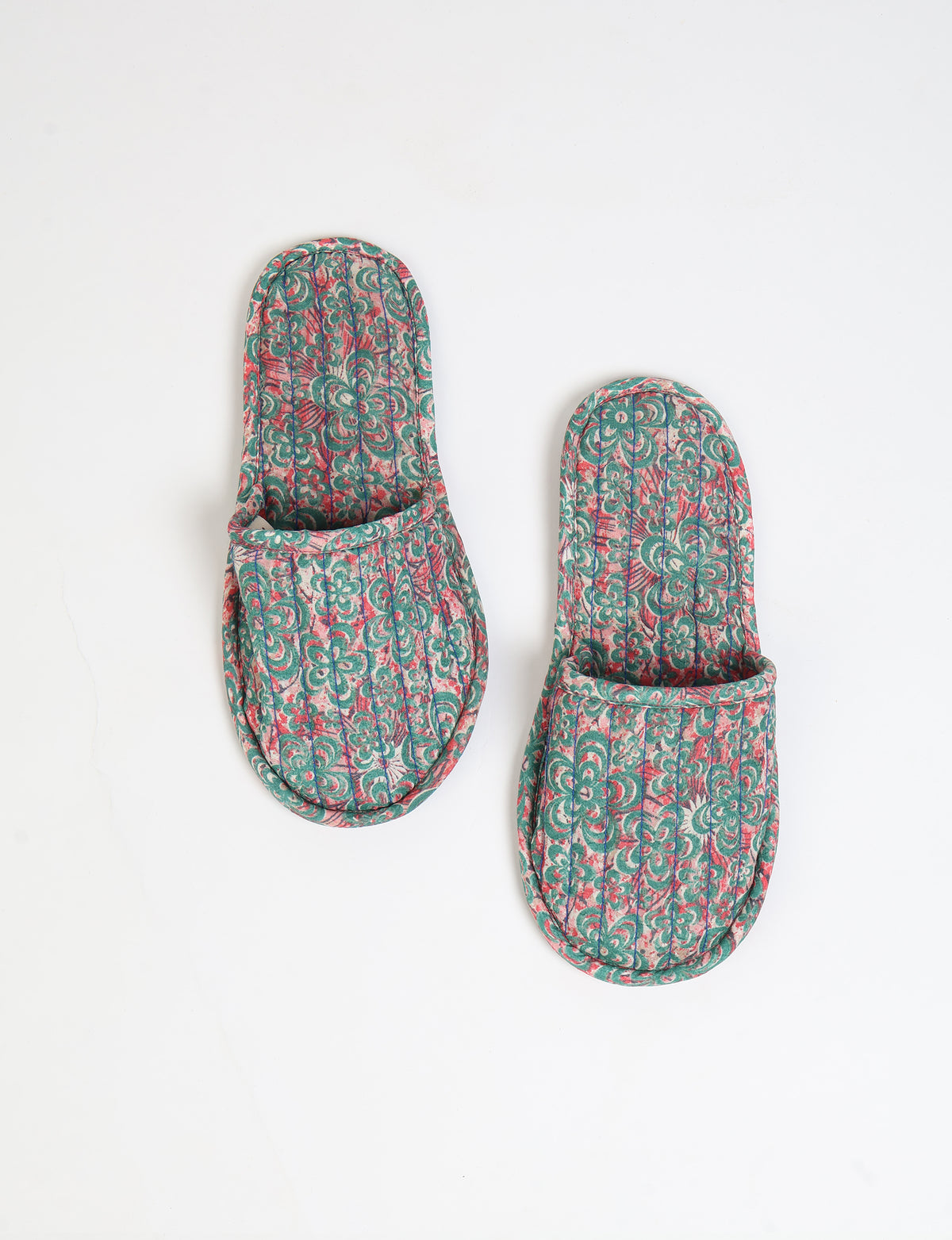 Elevate your downtime with our Quilted Slippers. Ethical, sustainable, and crafted by female artisans in Mumbai, these slippers offer cushioned comfort with a touch of chic style. Warm on the inside, fashionable on the outside, step into sustainable luxury.