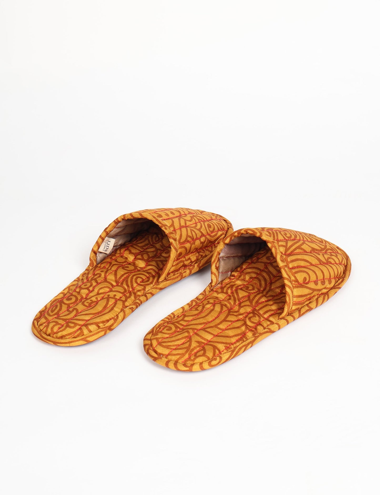 Elevate your downtime with our Quilted Slippers. Ethical, sustainable, and crafted by female artisans in Mumbai, these slippers offer cushioned comfort with a touch of chic style. Warm on the inside, fashionable on the outside, step into sustainable luxury.