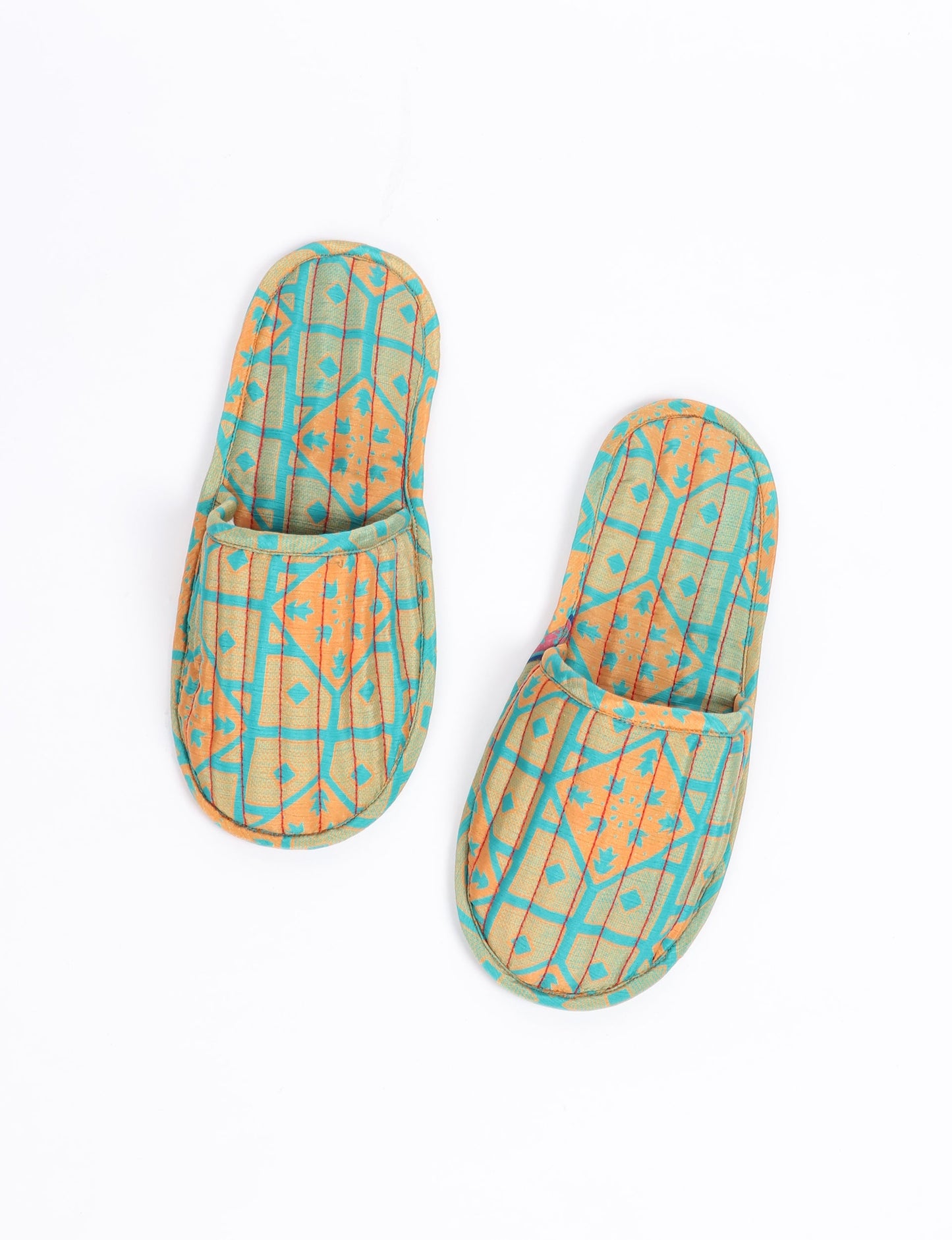 Elevate your downtime with our Quilted Slippers. Ethical, sustainable, and crafted by female artisans in Mumbai, these slippers offer cushioned comfort with a touch of chic style. Warm on the inside, fashionable on the outside, step into sustainable luxury.