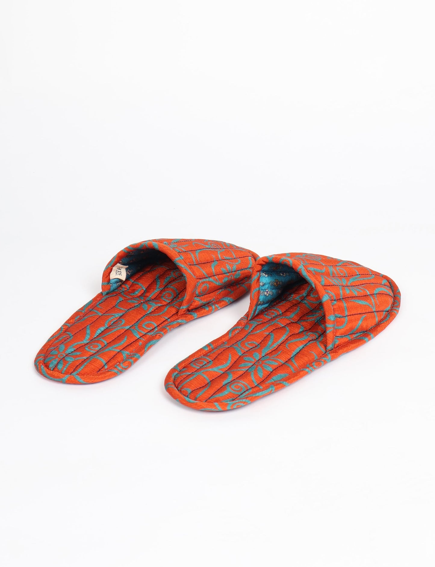 Elevate your downtime with our Quilted Slippers. Ethical, sustainable, and crafted by female artisans in Mumbai, these slippers offer cushioned comfort with a touch of chic style. Warm on the inside, fashionable on the outside, step into sustainable luxury.