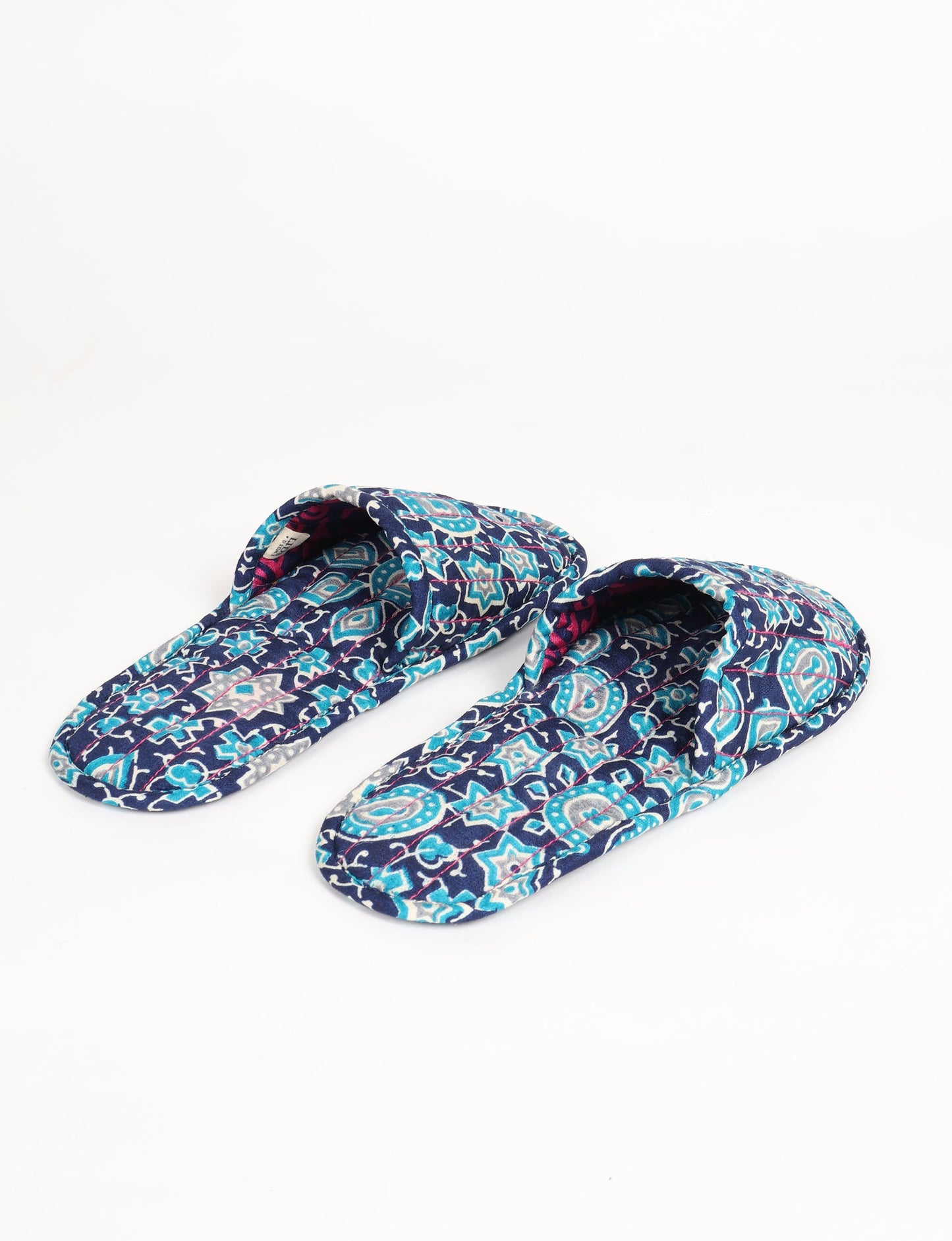 Elevate your downtime with our Quilted Slippers. Ethical, sustainable, and crafted by female artisans in Mumbai, these slippers offer cushioned comfort with a touch of chic style. Warm on the inside, fashionable on the outside, step into sustainable luxury.
