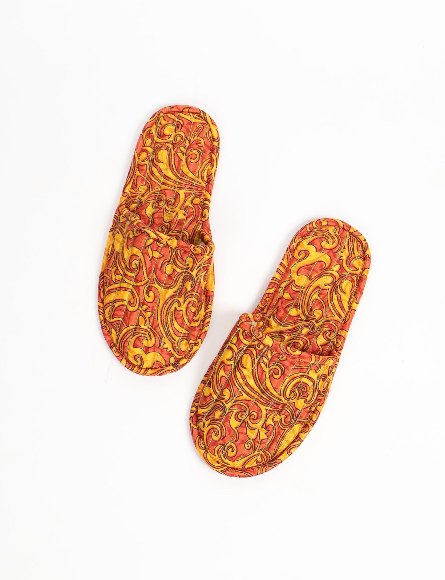 Elevate your downtime with our Quilted Slippers. Ethical, sustainable, and crafted by female artisans in Mumbai, these slippers offer cushioned comfort with a touch of chic style. Warm on the inside, fashionable on the outside, step into sustainable luxury.