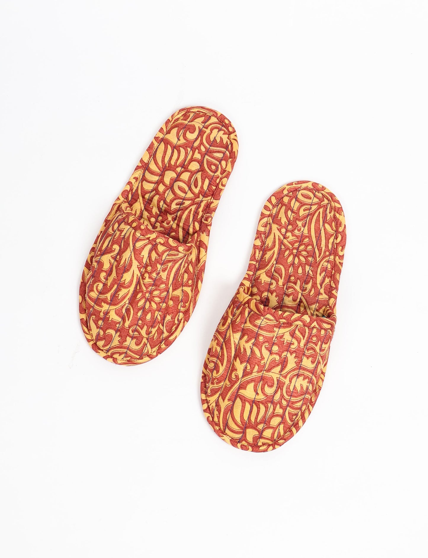 Elevate your downtime with our Quilted Slippers. Ethical, sustainable, and crafted by female artisans in Mumbai, these slippers offer cushioned comfort with a touch of chic style. Warm on the inside, fashionable on the outside, step into sustainable luxury.