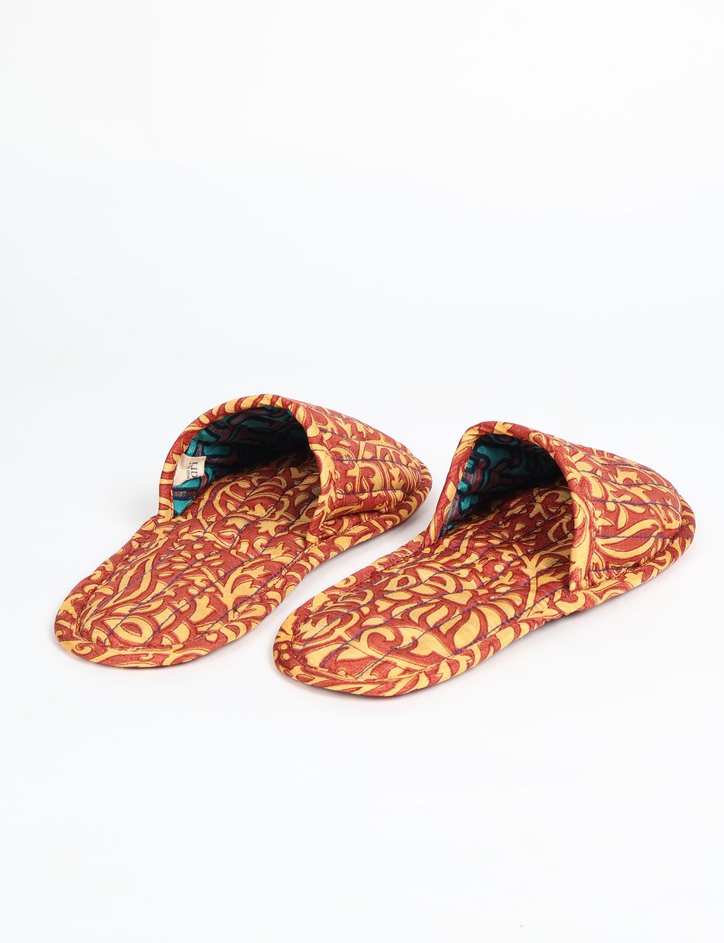 Elevate your downtime with our Quilted Slippers. Ethical, sustainable, and crafted by female artisans in Mumbai, these slippers offer cushioned comfort with a touch of chic style. Warm on the inside, fashionable on the outside, step into sustainable luxury.