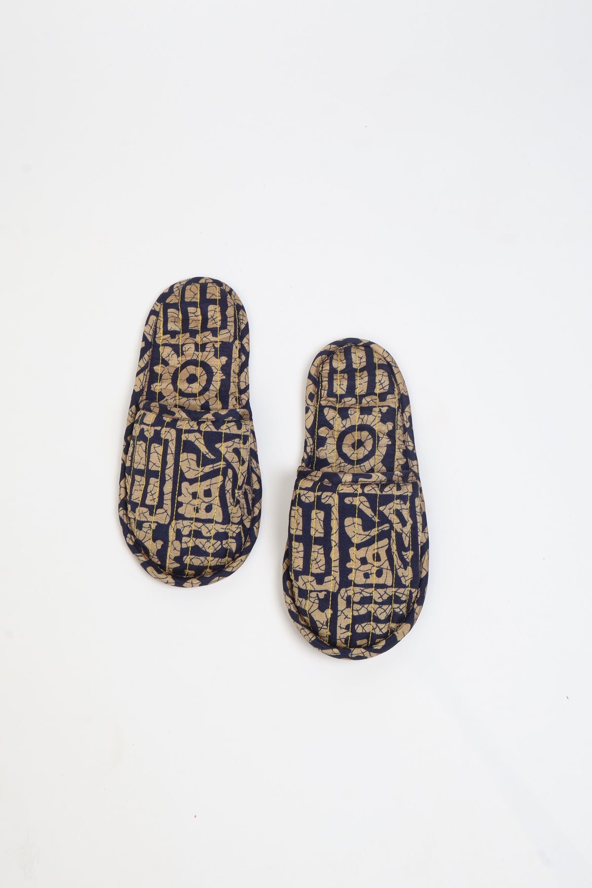 I was a Sari Quilted Slippers in blue with intricate gold ethnic patterns and a padded design for comfort.