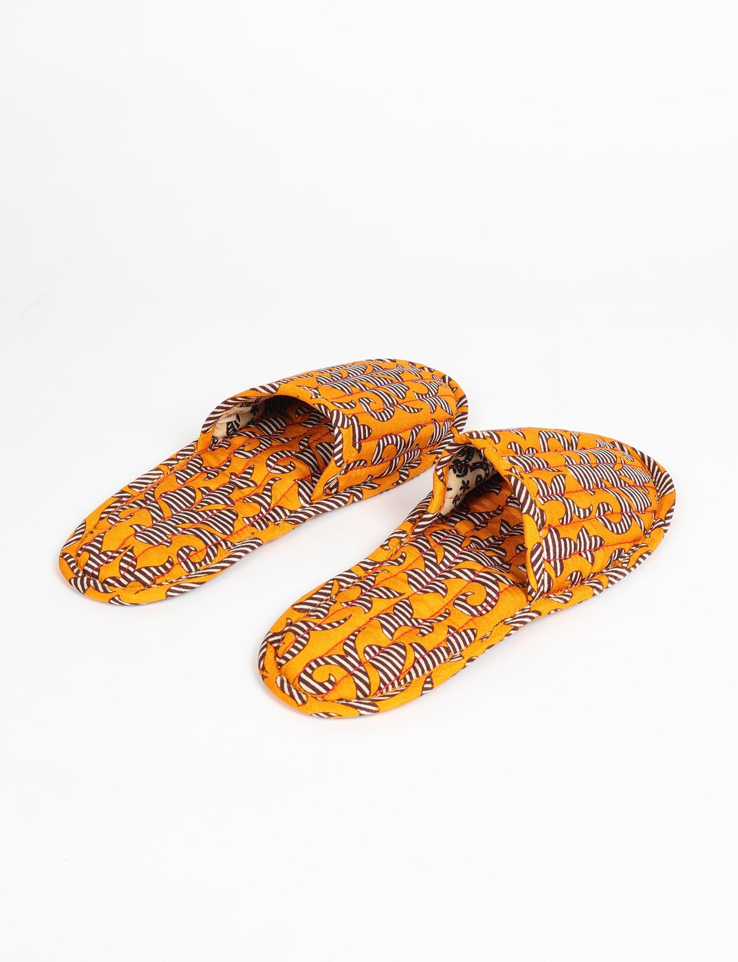 Elevate your downtime with our Quilted Slippers. Ethical, sustainable, and crafted by female artisans in Mumbai, these slippers offer cushioned comfort with a touch of chic style. Warm on the inside, fashionable on the outside, step into sustainable luxury.