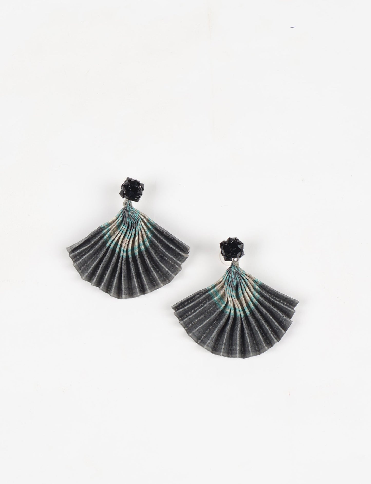Elevate your style sustainably with our PLEATED EARRINGS – a harmonious blend of ethical fashion and eco-conscious design. Fashioned using innovative heat setting techniques on pre-loved Indian saris, these accessories showcase a commitment to slow fashion and upcycled fashion. Enjoy planet-friendly charm with hypoallergy tested metal hooks, nickel, and lead-free for a skin-friendly touch.