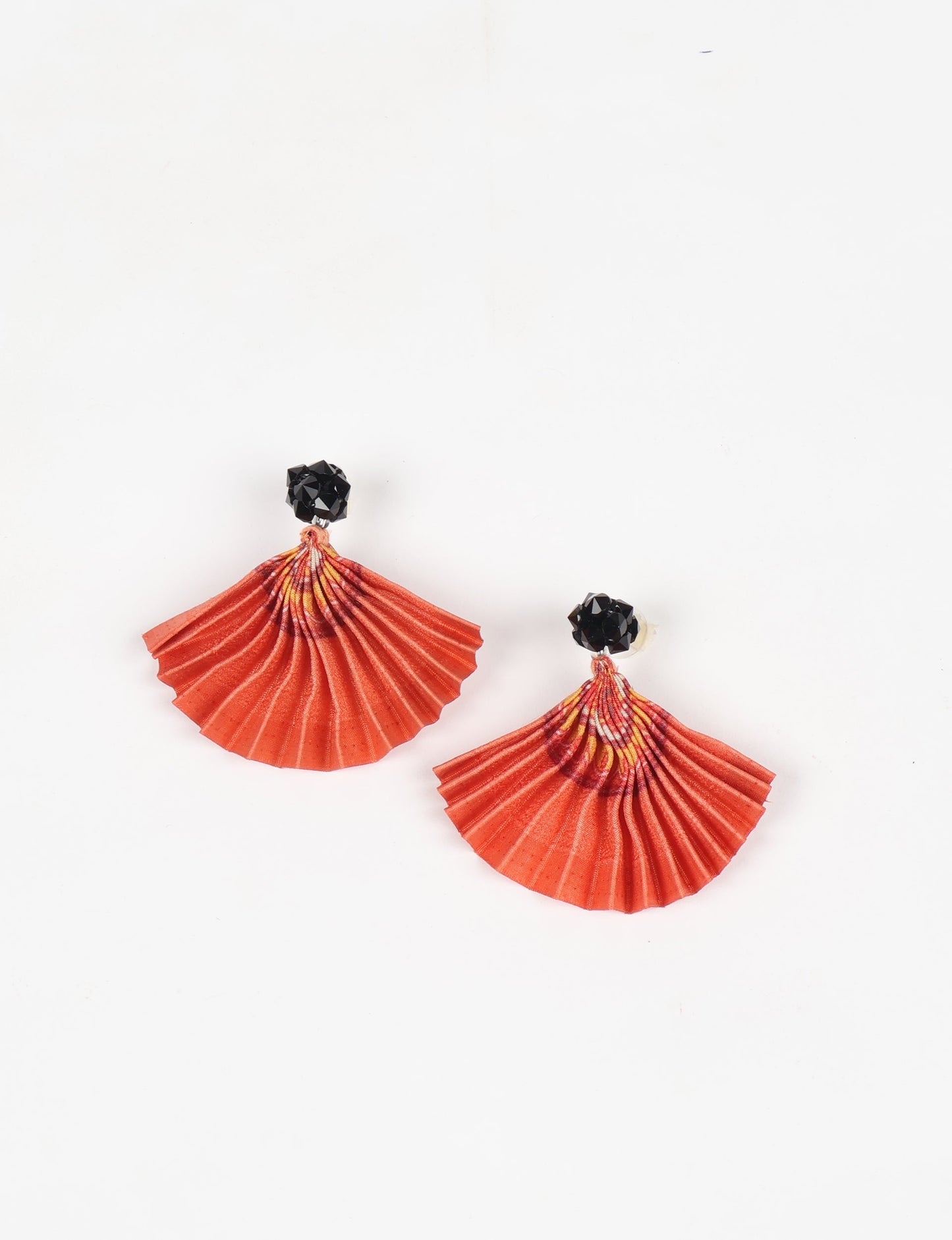 Elevate your style sustainably with our PLEATED EARRINGS – a harmonious blend of ethical fashion and eco-conscious design. Fashioned using innovative heat setting techniques on pre-loved Indian saris, these accessories showcase a commitment to slow fashion and upcycled fashion. Enjoy planet-friendly charm with hypoallergy tested metal hooks, nickel, and lead-free for a skin-friendly touch.