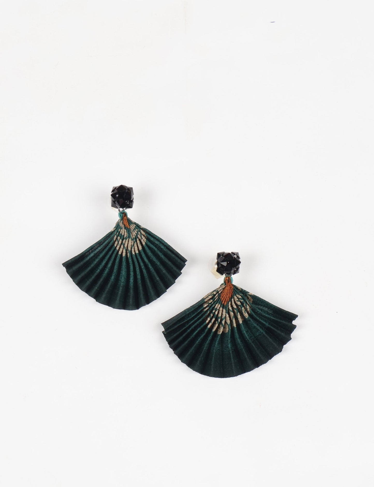 Elevate your style sustainably with our PLEATED EARRINGS – a harmonious blend of ethical fashion and eco-conscious design. Fashioned using innovative heat setting techniques on pre-loved Indian saris, these accessories showcase a commitment to slow fashion and upcycled fashion. Enjoy planet-friendly charm with hypoallergy tested metal hooks, nickel, and lead-free for a skin-friendly touch.