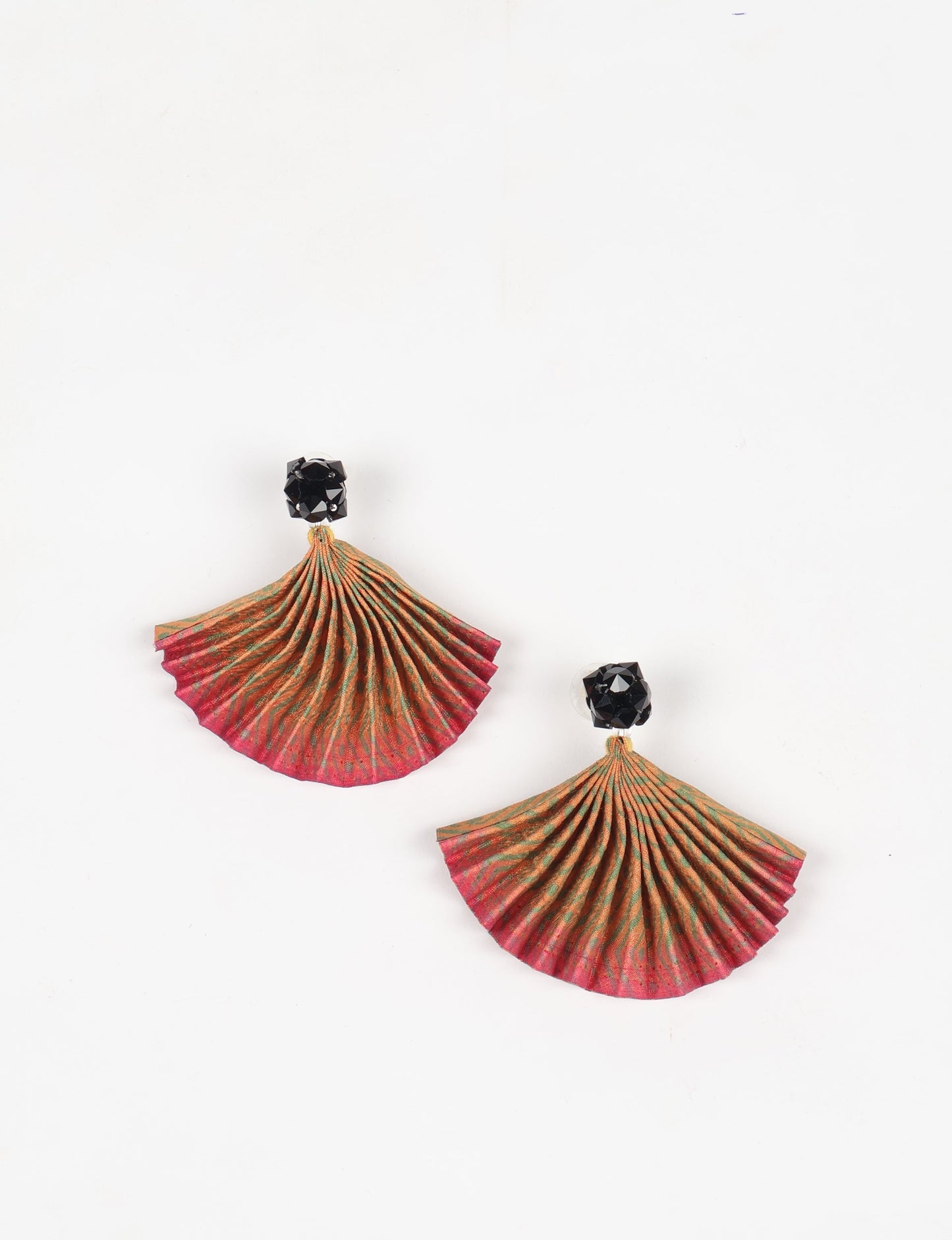 Elevate your style sustainably with our PLEATED EARRINGS – a harmonious blend of ethical fashion and eco-conscious design. Fashioned using innovative heat setting techniques on pre-loved Indian saris, these accessories showcase a commitment to slow fashion and upcycled fashion. Enjoy planet-friendly charm with hypoallergy tested metal hooks, nickel, and lead-free for a skin-friendly touch.