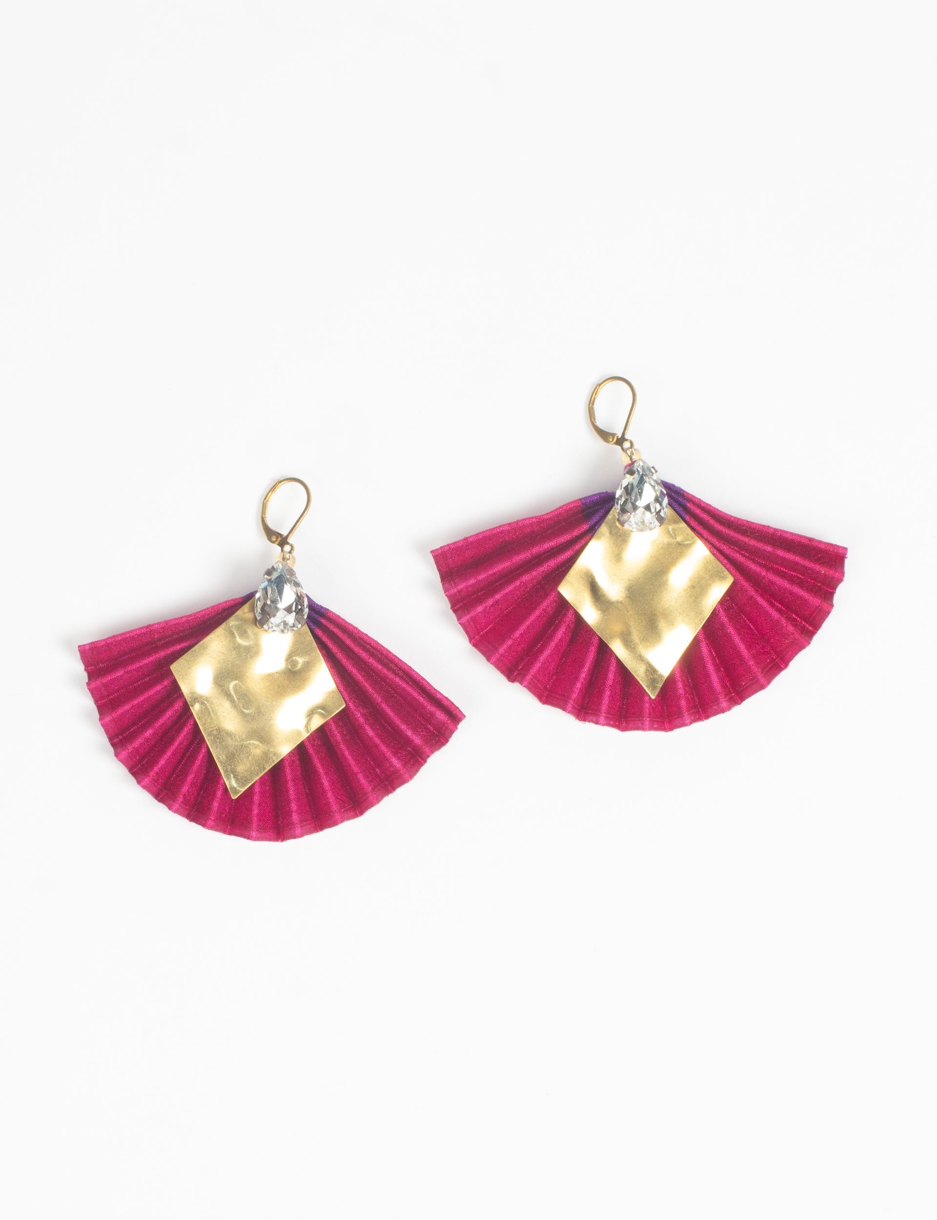 Pink pleated fan-shaped earrings with hammered gold diamond accents and clear teardrop crystals, shown flat on white background
