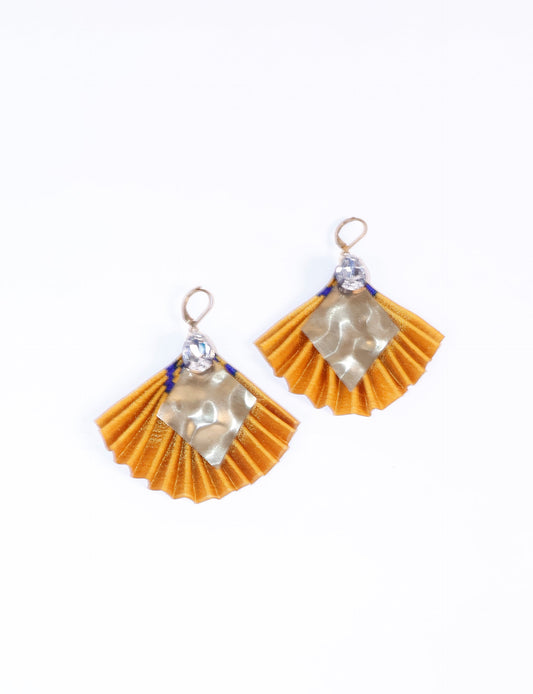 Elevate your style sustainably with our PLEATED EARRINGS – a fusion of ethical fashion and eco-conscious design. Created from pre-loved saris using heat set pleats, these earrings embody zero waste clothing and upcycled fashion. Fastened with hooks, adorned with a diamond-shaped metallic plate and a special drop-shaped jewel. Hypoallergy tested metal hooks, nickel, and lead-free, making them a conscious and skin-friendly accessory.