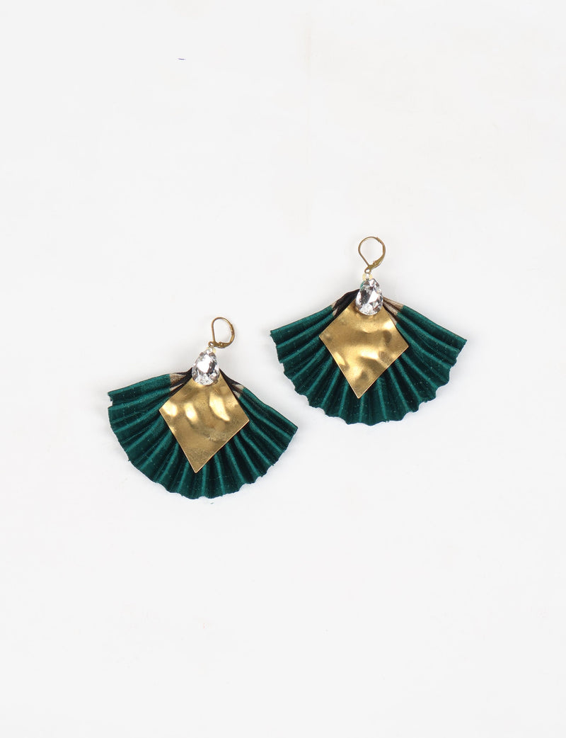 Green pleated fabric earrings with gold diamond-shaped metal accents and clear teardrop crystals, shown flat on white background