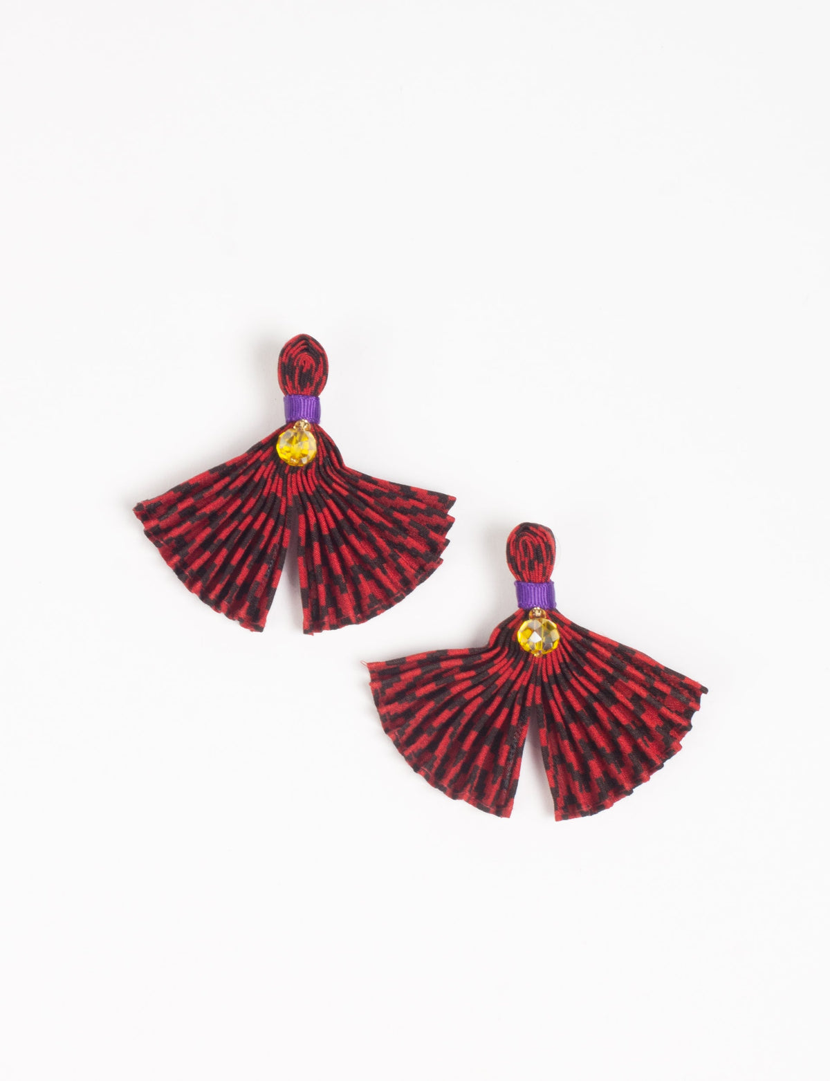 Red and black pleated fabric earrings with purple band and yellow gem detail, shown flat on white background