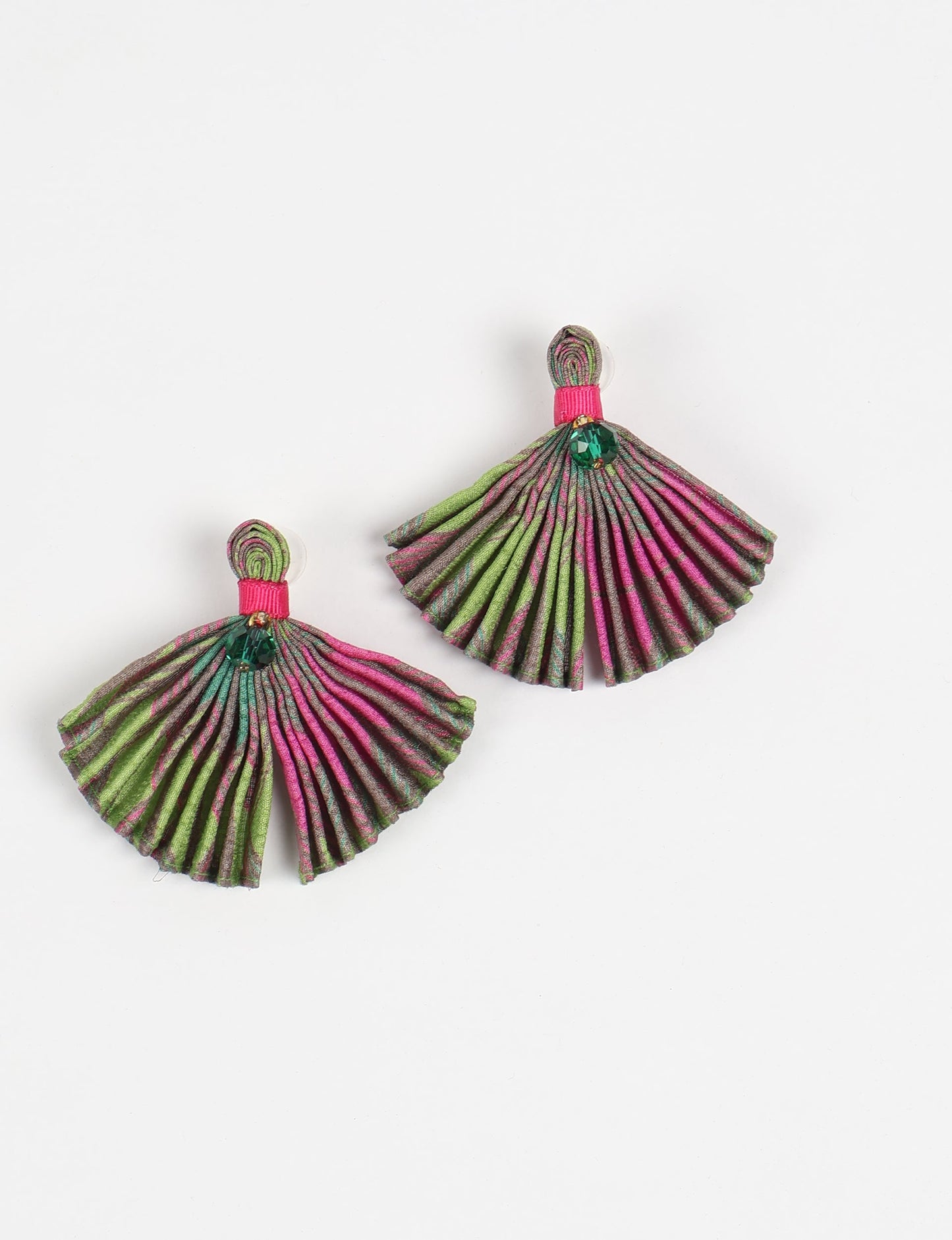 Adorn yourself sustainably with our PLEATED EARRINGS – fan-shaped wonders with a top knot and a tiny stone. Meticulously hand-pleated from Indian saris, these earrings reflect ethical clothing, green fashion, and slow fashion. Fastened with hypoallergy tested metal hooks, nickel, and lead-free, making them a conscious and stylish accessory.